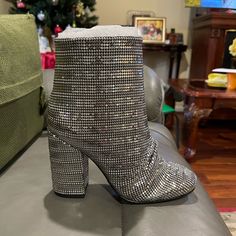 New With Box Schutz Silver Boots Chic Shiny Boots For Party, Elegant Silver Boots With Round Toe, Glamorous Metallic Silver High Heel Boots, Glamorous Metallic Boots, Glamorous Metallic Shiny Boots, High Heel Silver Boots With Bling, Silver High Heel Boots With Bling, Metallic Round Toe Heels With Rhinestones, Luxury Silver High Heel Boots