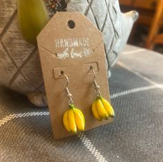 These cute handmade clay banana earrings/necklace is great for any occasion! Casual Handmade Yellow Jewelry, Casual Yellow Handmade Jewelry, Clay Jewelry With Matching Earrings For Gift, Yellow Resin Jewelry For Gifts, Yellow Resin Jewelry Gift, Yellow Resin Jewelry As Gift, Yellow Resin Jewelry As A Gift, Casual Yellow Earrings For Gift, Casual Yellow Earrings Perfect For Gifts