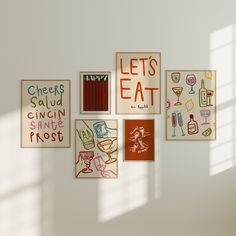 there are many posters on the wall with words and pictures attached to it, including one that says let's eat