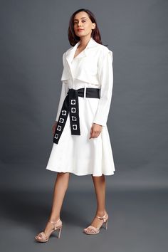 White jacket dress with notched lapel collared neckline. Paired with sash belt.
Components: 2
Type Of Work: Plain
Neckline: Notched lapel collar
Sleeve Type: Full sleeves
Fabric: Ponte Roma
Color: White
Other Details: 
Front button detailing
Belt loop detailing
Occasion: Party - Aza Fashions White Jacket Dress, Belt For Women, Sash Belts, Sash Belt, Fashion App, Sleeve Jacket, White Jacket, Full Sleeves, Lapel Collar