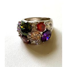 NVC - Nataliya V Collister CZ Multi-Stone Cluster Ring Size 9 1/2 This beautiful flashing sparkling multi-colored ring is a stunning addition to any wardrobe. Multicolor cubic zirconia stones are prong set in a silver tone metal with style and glamour in mind. It is perfect for any occasion. The ring is marked NVC. Previously owned. Excellent condition. Dazzling Multicolor Multi-stone Jewelry, Dazzling Multicolor Cubic Zirconia Rings, Multi-stone Cubic Zirconia Party Rings, Party Rings With Multi-stone Cubic Zirconia, Multicolor Multi-stone Rings For Parties, Dazzling Multicolor Rings With Accent Stones, Multicolor Multi-stone Party Rings, Anniversary Crystal Rings With Stone Setting, Multicolor Gemstone Ring For Party