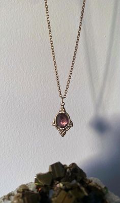 A precious handmade gold necklace with a unique vintage geometric antique brass pendant and a high quality rose cut Amethyst.  Amethyst is the February birthstone and is a calming crystal with soothing energy that provides balance, patience and peace and the one you will receive in this necklace is a deep bright purple. It is also associated with the 7th chakra in meditation, the Crown chakra and is used to help focus on healing any blockages. The necklace has a gold filled fastening at the back Handmade Gold Necklace, Bright Purple, Brass Necklace, Amethyst Necklace, Short Necklace, February Birth Stone, Brass Pendant, Silver Chain Necklace, Amethyst Stone