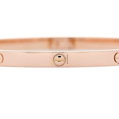 This is an authentic CARTIER 18K Pink Gold Small LOVE Bracelet size 17. The bracelet is crafted of 18 karat pink gold and features the signature LOVE screw motifs engraved throughout the bangle. Love Bracelet, Love Bracelets, Bracelet Sizes, Pink Gold, Cartier, Pink And Gold, Screw, Bangles, Bracelet