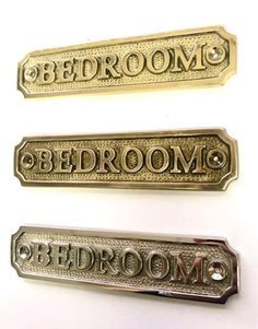 three different types of metal name plates