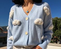 Unique Cardigan Chunky Cloud Embroidery,Cozy Cloudy Punch Needle Women Sweater, Handmade Crop Knit Outfit,Gift kit for her,Baby Blue Y2k Top This cardigan is a UNIQUE and one and only piece. It is handknitted with mixture of cotton and polyester yarn. (%70 Cotton, %30 Polyester) Chunky Cloud Pattern is created with Punch Needle Technique and %100 baby cotton yarn is used. EACH CARDIGAN IS MADE TO ORDER, BUTTON COLOUR MAY VARY 100% Handmade, Free Shipping SIZE: One size fits for 34,36,38,40 // XS Cute Blue Winter Sweater, Cute Hand Knitted Blue Sweater, Cute Blue Hand Knitted Sweater, Cute Blue Hand-knitted Sweater, Cute Blue Knit Cardigan, Handmade Blue Sweater For Spring, Cute Blue Knit Sweater, Playful Blue Knitted Sweater, Handmade Blue Spring Sweater