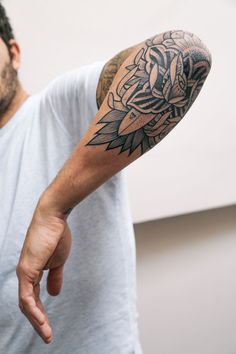 a man with a tattoo on his arm