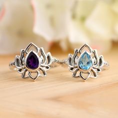 Natural Blue Topaz Lotus Ring-Handmade Lotus Amethyst Silver Ring-Sterling Silver Ring-Silver Lotus Ring-Gift for her- December Birthstone Stone Material:-  Amethyst, Blue Topaz Weight (Approx.):- 3.90 Gram Length:- 15mm Width:- 3 mm  Height:- 5 mM Stone Size (Approx.):- 7 x 5 mm Pear Total Number of Stones:  1 Stone Setting: Bezel Setting Metal: 925 Sterling Silver Finish: High Polish GN-R-1089 Sterling Silver Gemstone Flower Ring, Silver Birthstone Ring With Natural Stones For Gift, Sterling Silver Flower Ring With Gemstone, Sterling Silver Flower Ring With Accent Stones For Gift, Spiritual Topaz Gemstone Ring As Gift, Spiritual Style Topaz Gemstone Ring As A Gift, Silver Spiritual Birthstone Ring With Accent Stones, Spiritual Gift Topaz Ring With Gemstone, Spiritual Sterling Silver Crystal Birthstone Ring