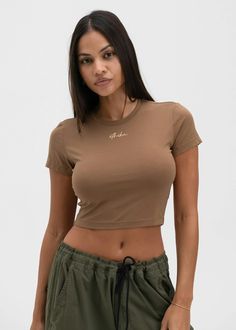 Short Sleeve Baby Tee
Cropped Fit at Waist
Crew Neckline
Custom Front Graphic
55% Cotton 37% Modal 8% Spandex Fitted Brown Basic Crop Top, Sporty Stretch Brown Tops, Sporty Brown Stretch Top, Fitted Brown Crop Top With Short Sleeves, Brown Fitted Short Sleeve Crop Top, Fitted Brown Short Sleeve Crop Top, Sporty Brown Tops For Spring, Sporty Brown Top For Spring, Seamless Crew Neck Tops