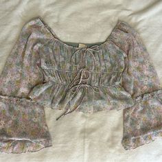 Nwt. Altar’d State - Pastel Floral Bell Sleeve Blouse, New With Tags Still Attached - Size: Small - Slightly Cropped, Ruffle Details, Adjustable Tie Strings, And Elastic Neckline. Cute Fitted Spring Blouse, Cute Fitted Blouse For Spring, Cute Fitted Blouse For Brunch, Bead Knit, Sweater Crop, Crochet Halter Tops, Summer Crop Tops, Burgundy Floral, Pastel Floral