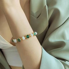 Charm Jewelry BCJTXY35: Elevate Your Style with this Unique Baroque Pearl Bracelet Introducing the Baroque Pearl Green Stone Round Bead Bracelet Charm Jewelry for Women! This stunning piece of jewelry is a must-have for any fashion-conscious woman looking to make a statement with their accessories. Crafted from high-quality copper alloy, this bracelet features a beautiful snake chain with a toggle clasp for easy wearing. The standout feature of this bracelet is the stunning semi-baroque pearl be Green Stretch Bracelet With Colorful Beads For Party, Green Stretch Bangle Bracelet With Colorful Beads, Green Stretch Bangle With Colorful Beads, Green Stretch Bracelet With Colorful Beads, Green Jade Bangle Beaded Bracelets, Green Round Beads Bracelets For Party, Green Stretch Bracelet With Round Beads For Party, Green Round Bracelets For Party, Green Round Beads Stretch Bracelet For Party