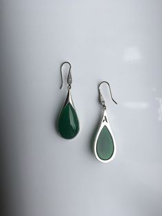 A pair of vintage dark green jade earrings. The teardrop-shaped earrings are made from quality green jade and 925 sterling silver hooks. The big emerald-like green jade drops are heavy-duty, comes with antique silver hooks. It's truly a great combination of modern minimalistic design and ancient Chinese royalty taste. Some highlights of this elegant and fancy dangle silver jade earrings are: *High-quality materials Quality green jade, 925 sterling silver. Great for sensitive skins and ensure lon Teardrop Jade Earrings For Formal Occasions, Green Sterling Silver Teardrop Earrings Hypoallergenic, Green Drop Earrings Hypoallergenic, Green Drop Hypoallergenic Earrings, Green Drop Earrings, Pierced, Green Pierced Drop Earrings, Jade Drop Earrings For Anniversary, Elegant Jade Teardrop Earrings, Elegant Teardrop Jade Earrings