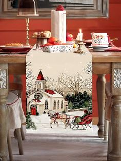 a christmas table runner with a horse drawn sleigh and church in the background