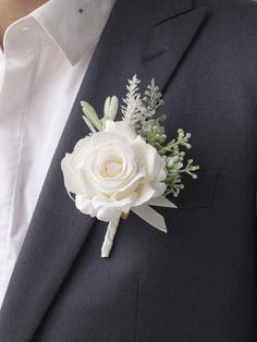 a man in a suit with a boutonniere on it's lapel