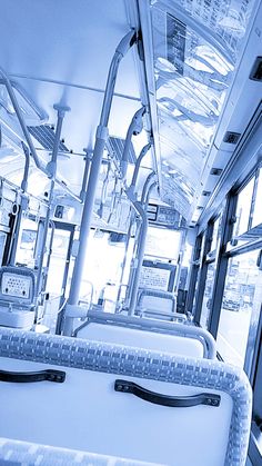 the interior of a public transit bus with empty seats