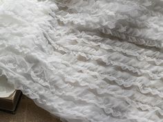 "Chiffon Ruffled fabric, Pleated Layers Chiffon Lace Fabric, Ruffled Fabric for Cake dress, Bridal Gown, Tutu Dress, Mini Dress, 1 Yard This listing is for one yard Measurement (approx): 53\" in width (135 cm) Qty: 1 yard ( Additional quantities are available.) Color: apricot, off white, black DIY homemade fabric, Wedding, Bridal dress, Ribbon flowers, jewelry design, doll clothes, cake, dolls, hang adorn, bra decoration, small parts, home decor... and so on, or any other crafts you like Wholesa White Chiffon Dress With Ruffles, White Flowy Chiffon Dress With Ruffles, Flowy White Chiffon Dress With Ruffles, Cotton Gauze Fabric, Ruffle Fabric, Dress Cake, Chiffon Ruffle, Pleated Fabric, Chiffon Lace