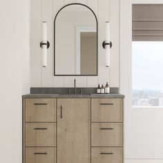 a bathroom with two sinks and a large mirror