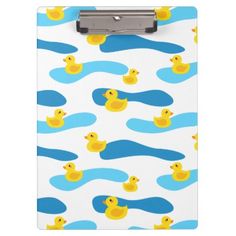 a clipboard with rubber ducks in blue and yellow on the front, against a white background