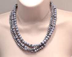 Smoky Grey Collar Necklace, 3 Strand Gray Gunmetal Crystal Necklace, Layered Statement Necklace, Wedding Jewelry, Pearl Jewelry Gift Three strand 6 & 8mm grey glass, 6mm grey glass pearls, gunmetal crystal accent. Lobster claw clasp closure. 18" in length.  #N516 Wanna See More? Click below for other items available: http://www.etsy.com/shop/StudioMJewelry Shipping: All jewelry pieces are ready to ship. Items are shipped to your Etsy address, via USPS First Class mail with tracking and delivery Statement Necklace Wedding, Pearl Jewelry Gift, Necklace Layered, Jewelry Pearl, Necklace Wedding, Grey Glass, Multi Strand Necklace, Strand Necklace, Collar Necklace