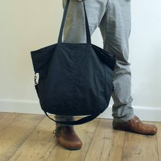 Waxed canvas tote, waxed canvas shopper, black purse, messenger bag, waxed bag, unisex tote, vegan b Everyday Black Duffle Bag With Pockets, Black Cotton Weekender Bag With Large Capacity, Black Duffle Bag With Pockets For On-the-go, Black Cotton Weekender Bag For Everyday Use, Practical Black Weekender Bag, Black Duffle Bag With Waxed Finish For Everyday Use, Black Waxed Canvas Bags For On-the-go, Black Waxed Canvas Bag For On-the-go, Black Waxed Canvas Shoulder Bag For On-the-go