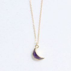 "*PRODUCT DETAIL* ✧ Moon shaped natural amethyst gemstone necklace ✧ Available in gold filled chain. ✧ Pendant : 13mm, Gold plated ✧ Double wrap chain option: It's longer version of the chain that's designed to give extra wrap around your neck. Ex: Pendant of 29\" chain is designed to fit as 14.5\" length of necklace after it's wrapped around your neck. *Crescent gemstone options* -AMETHYST (February birthstone) -AQUAMARINE (March Birthstone) -EMERALD (May birthstone) -MOONSTONE (June birthstone Amethyst Birthstone Pendant Crystal Necklace, Spiritual Amethyst Necklace With Moon Charm, Spiritual Purple Necklace With Moon Charm, Purple Crescent Spiritual Jewelry, Spiritual Purple Crescent Jewelry, Spiritual Purple Moon Phase Jewelry, Purple Pendant Necklace With Moon Charm, Purple Moon Charm Pendant Necklace, Amethyst Moon Charm For Jewelry Making