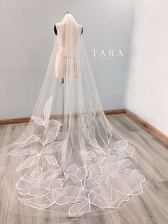 a wedding veil with flowers on it