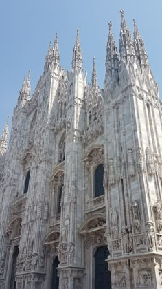 an ornate building with many windows and statues