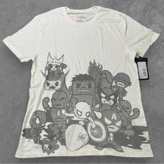 Tokidoki Marvel T-Shirt Size: Large Color: Off-White With Grey Tokidoki Graphic Style Name: Elite Dudes Material: Cotton Country Of Manufacture: Designed In Italy, Made In Guatemala Care: Machine Wash Condition: New With Tags. No Holes, Stains Or Tears Weight: 6 Oz Color May Vary Slightly Due To Photographic Lighting Sources Or Your Monitor Settings Please Review Photos For Measurements, Quality, And Condition. I Do My Best To Find And Disclose Any Flaws Prior To Listing. There May Be Flaws Pres White Cotton Shirt With Cartoon Print, White Fun T-shirt With Character Print, Fun White Shirt For Streetwear, Casual Unisex White Shirt, Unisex White T-shirt With Cartoon Print, Fun Unisex White Tops, Fun White Unisex Tops, Unisex White T-shirt With Character Print, White Unisex T-shirt With Character Print