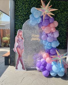 the balloon arch is decorated with balloons and stars