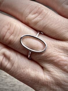 All rings from our geometric collection are solid 925 sterling silver. The geometric design is open and curved allowing the ring to fit comfortably over the natural shape of your finger. Base metal wire thickness is 1.5 mm for a lightweight, modern look. A percentage of my profit will be donated to the Coalition Against Trafficking in Women (CATW) - The world's first organization to fight human trafficking internationally. Care instructions: All pieces in my shop are unique and fragile, they are Modern Nickel Free Stackable Rings, Modern Sterling Silver Midi Rings With Open Band, Modern Sterling Silver Open Band Midi Rings, Modern Oval White Gold Stackable Rings, Modern Nickel-free Open Midi Rings, Sterling Silver Oval Stackable Rings, Modern Sterling Silver Open Ring Midi Rings, Modern Sterling Silver Open Midi Rings, Modern Oval Midi Rings As Gift