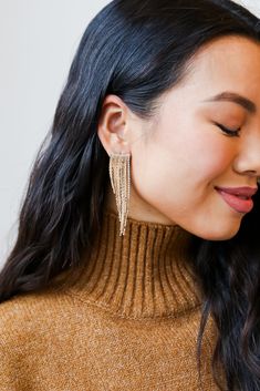 From cocktail hour to date night, the Riley Gold Rhinestone Fringe Earrings has everything you need to create a radiant outfit! These trendy gold earrings feature a stud post back with gold chain fringe + rhinestones! Style the Riley Earrings with a maxi dress + booties for a girly fall look! Gold Plated Rhinestones Fringe Stud Post Back One Size | Length 2.75” Diamante Earrings, Shoulder Duster Earrings, Duster Earrings, Dress Booties, Rhinestone Fringe, Lanyard Necklace, Chain Fringe, Kids Bracelets, Kids Earrings