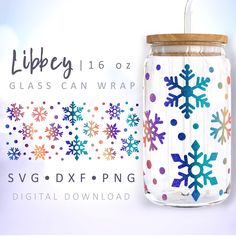 a glass jar with snowflakes painted on it and a straw in the lid