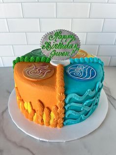 a birthday cake decorated with two different colors