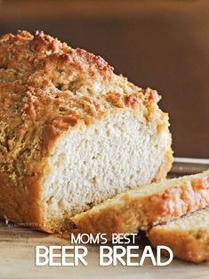 a loaf of beer bread sitting on top of a wooden cutting board with the words mom's best beer bread