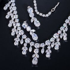 Experience the charm of the Cubic Zirconia Bridal Necklace in  elegant jewelry piece.

– This bridal shinning cubic zirconia gemstone necklace set is perfect for adding elegance to any bridal ensemble.
– Made with high-quality materials, this set includes a stunning necklace and matching earrings for a complete look.
– Perfect for pageant, bridal, bridesmaid, prom, quinceañera or special occasion Jewerly Set, Bridal Necklace Set, Crystal Jewelry Sets, Zirconia Necklace, Cubic Zirconia Necklace, Prom Jewelry, Cubic Zirconia Jewelry, Mobile Screen, Necklace Necklace