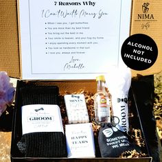 an open box containing alcohol, socks and other personal care items with a sign in the background