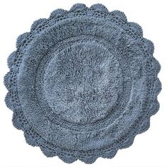 a round rug with crocheted edges in blue on a white background for use as a placemat