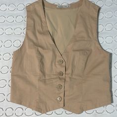 This Beautiful Vest Has Never Been Worn. I Bought It And I Was Hoping For A Looser Fit. It’s A Size Medium And It Has Some Stretch But Also Super Good Structure Material. It’s Very Flattering And So So Comfortable. (It’s Super Soft) I Also Have The Matching Skirt If Interested Beige Button-up Vest For Work, Fitted Beige Vest Outerwear, Beige Fitted Vest Outerwear, Classic Beige Vest Top, Fitted Beige Vest With Button Closure, Fitted Khaki Vest For Work, Vintage Beige Workwear Vest, Vintage Vest For Spring Workwear, Beige Vest