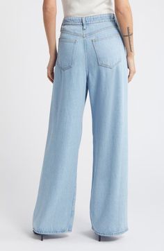 "Find FRAME Super Drape Wide Leg Denim Drawstring Pants on Editorialist. A less structured way to wear denim, these light and flowy pants keep you comfy with a drawstring waistband and full-length wide legs. 30\" inseam; 24\" leg opening; 12 1/2\" front rise; 15\" back rise (size 29) Elastic/drawstring waist Front scoop pockets; back patch pockets 100% lyocell Machine wash, dry flat Imported" Wide Leg Denim Bottoms With Drawstring, Light Wash Wide-leg Cotton Bottoms, Wide-leg Denim Bottoms With Drawstring, Blue Drawstring Wide-leg Bottoms, Pre-washed Denim Blue Wide Leg Bottoms, Latest Jeans, Comfy Jeans, Cotton Linen Pants, Flowy Pants