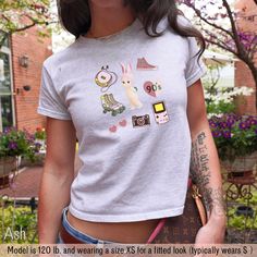 ⭐️ Get ready to fall in love with our Sonny Angel Baby Tee!  ⭐️ This adorable 90's Crop Top brings back all the nostalgic vibes of retro fashion.  ⭐️ Perfect for anyone who's into that Y2K baby tee style, this retro trendy baby tshirt will give you all the feels of a classic yet trendy look.  ⭐️ Whether you're channeling your inner coquette or just want a cute graphic tee to add to your collection, this one's a must-have.  ⭐️ It's snug, stylish, and oh-so-cute--grab yours now and rock that throw Cute Custom Print T-shirt For Streetwear, Cute Funny Print T-shirt For Streetwear, 90s Cartoon Print Tops For Spring, Cute T-shirt With Funny Print For Streetwear, Cute Everyday Short Sleeve Tops, 90s Style Cotton Tops For Everyday, Cute Short Sleeve Tops For Everyday, 90s Funny Print T-shirt For Spring, 90s Style Funny Print T-shirt For Spring