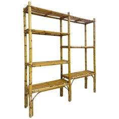 a bamboo shelving unit with three shelves and one shelf on the side, against a white background