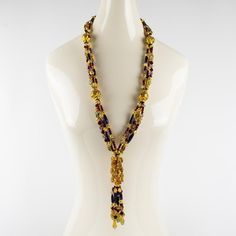 This is part of Chairish’s Costume Jewelry assortment.  Spectacular one-of-a-kind Christian Dior runway couture necklace. Extra-long multi-strand shape with dangling tassel. The necklace is all built with hand-blown Murano, Italy art glass beads and complemented with gilt metal carved spacers. This necklace was made for a Dior runway show in Paris in the 1980s as a prototype and was never turned into a ready-to-wear produced piece. The quality of each large carved bead is gorgeous with gold appl Elegant Multicolor Lariat Necklace, Elegant Multicolor Long Necklace For Party, Elegant Multicolor Lariat Beaded Necklace, Elegant Multicolor Lariat Beaded Necklaces, Luxury Long Necklace For Party, Elegant Yellow Multi-strand Necklace, Christian Dior Runway, Dior Runway, Couture Necklace