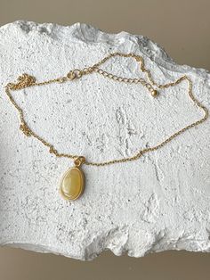 Embrace the captivating allure of the Baltic sea with this chic, elliptical amber pendant. Each piece showcases a pristine slice of natural Baltic amber, renowned for its warmth and depth, encased in a sophisticated gold-plated sterling silver frame. This pendant is the essence of elegance, designed to add a touch of timeless sophistication to any outfit. Its unique organic patterns ensure that no two pendants are alike, offering you an exclusive piece of the earth's beauty. Sterling silver, amber, gold plated Chain length 16.5 - 18" Stone size 0.71" Weight 0,22 oz Organic Patterns, Organic Pattern, Amber Pendant, Linking Rings, Amber Jewelry, Baltic Sea, Baltic Amber, Gold Plated Chains, Silver Frame