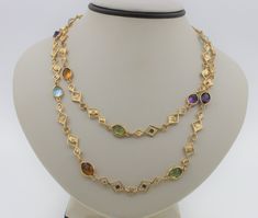 GORGEOUS unique 14K yellow gold necklace with multiple stones. The necklace includes Citrine, Blue Topaz, Amethyst and Peridot. Perfect gift for your loved one! This necklace is elegant yet simplistic, perfect for everyday wear.  The chain is 14K yellow gold and measures 30.50 inches long. The necklace weighs: 26.2 g Will be placed into a suitable gift box Free shipping within the U.S.