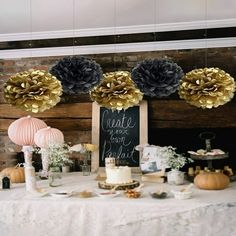 a table topped with lots of cake and decorations