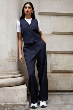 Elevate your style with this fitted waistcoat from Threadbare, perfect to hit the soft tailoring trend. With a v-neck opening and button fastening, add a sophisticated modern edge to any outfit whether you wear it as a standalone statement piece or as a layer over t-shirts or dresses. Matching trousers are also available to wear as a co-ord. Model wears UK size 8. Fitted Waistcoat Women, Open Waistcoat Outfit, Vest Trouser Outfit, Off White Shirt Women Outfit, Style A Waistcoat Women, Trouser Vest Outfit, V Neck Vest Outfits For Women, Cool Smart Casual Women, Pinstripe Vest Women Outfit