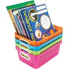 three plastic baskets with books in them