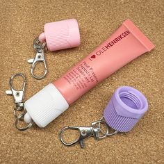 Take your lip care everywhere with the Keychain Lip Balm Holder, designed to fit your Ole Henriksen lip balm tube! Perfect for clipping onto your lanyard, keys, or bag for quick access and ultimate convenience. 🔒HOLDS ON TIGHT Replace your original cap with this threaded design that screws on securely (doesn't slide over) and features a built-in stopper to prevent spills. 🤲 SUPER COMFY GRIP The easy-to-hold shape makes opening and closing smooth and effortless--even when you're on the move. 🔗 Best Friend Farewell, Ole Henriksen, Lip Balm Tubes, Lip Balm Holder, Lip Balm Gloss, Lip Care, Lanyard, Lip Balm, Lips