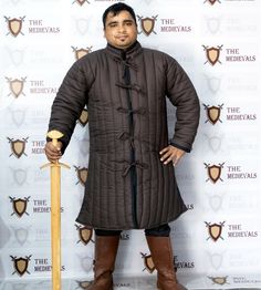 Medieval Gambeson thick padded coat Aketon vest Jacket Armor COSTUMES DRESS SCA BEST FITTING: Refer to the size chart to find a perfect fitting Gambeson Coat for yourself. CUSTOM DESIGN: We offer customization in size, design, Materials, colors , thickness, padding, button, laces or other aspects via merchant orders only. MATERIAL: The Gambeson coat is made of high-quality cotton fabrics. It has raw cotton pads and cotton linen for added comfort, breathability, and durability. AVEALABLE FINISH: Medieval Fitted Winter Outerwear, Medieval Style Fitted Long Sleeve Outerwear, Fitted Medieval Style Long Sleeve Outerwear, Fitted Medieval Long Sleeve Outerwear, Long Sleeve Winter Outerwear For Cosplay, Medieval Style Outerwear For Cosplay With Buttons, Black Fitted Medieval Outerwear, Viking Style Outerwear Costume For Fall, Viking Costume Outerwear For Fall