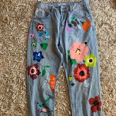 Flower Painted Jeans Beautiful Never Worn Comfortable And Stretchy Casual Multicolor Floral Embroidery Bottoms, Casual Multicolor Floral Embroidered Bottoms, Multicolor Floral Embroidered Bottoms For Spring, Spring Multicolor Floral Embroidered Bottoms, Painting Pants, Senior Pants, Spray Paint Flowers, Painting Jeans, Jacket Painting