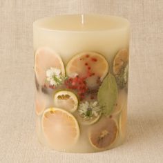 a candle that has some fruit on it